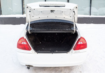 Подержанный автомобиль Mitsubishi Lancer Sedan 2000 года (19 фото)