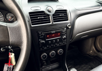 Подержанный автомобиль Nissan Almera Classic 2010 года (11 фото)