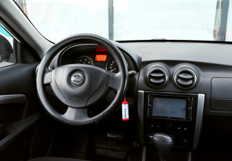 Подержанный автомобиль Nissan Almera Sedan 2014 года (16 фото)