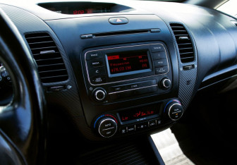 Подержанный автомобиль Kia Cerato Sedan 2013 года (10 фото)