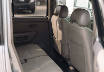 Подержанный автомобиль Nissan Cube 2001 года (14 фото)