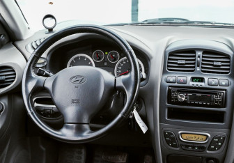 Подержанный автомобиль Hyundai Santa Fe 2012 года (11 фото)